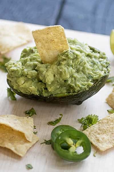 Homemade guacamole served in an avocado shell