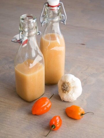 Garlic-Habanero Hot Sauce served in a bottles.