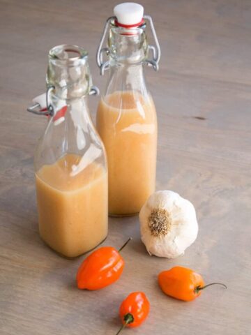 Garlic-Habanero Hot Sauce served in a bottles.