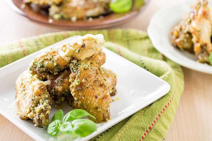 A stack of tender, crispy chicken wings on a plate, fresh from the pressure cooker