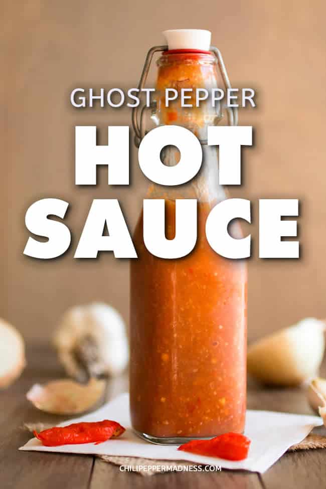 Ghost Pepper Hot Sauce - Make your own ghost pepper hot sauce at home with this recipe, which includes plenty of chopped ghost peppers, tomatoes, vinegar and salt. Big flavor, big spice! | ChiliPepperMadness.com #HotSauce #GhostPeppers #Spicy