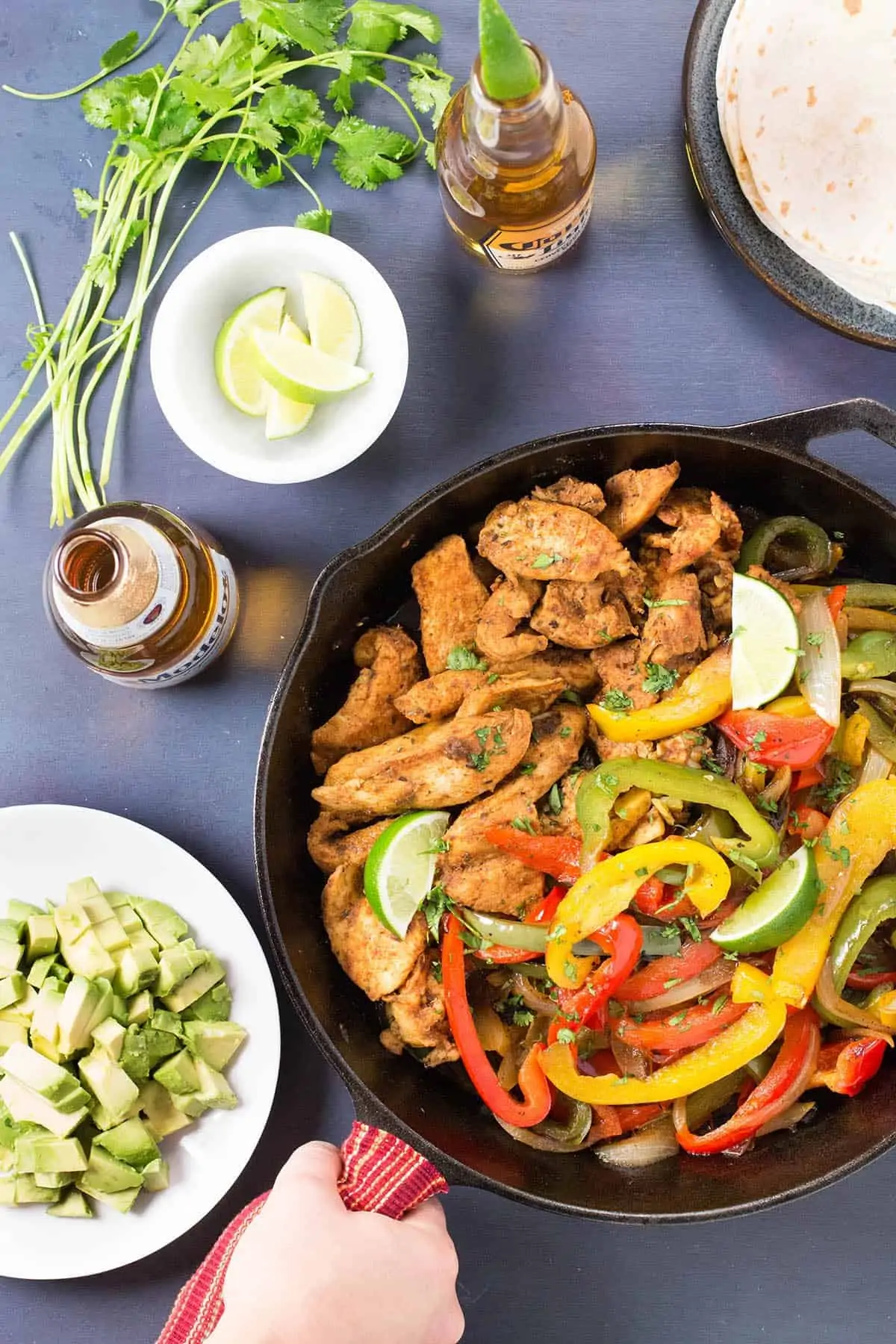 Serving Braised Chicken Fajitas in a skillet.