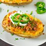 Jalapeno Popper Twice Baked Potatoes served on a big white plate