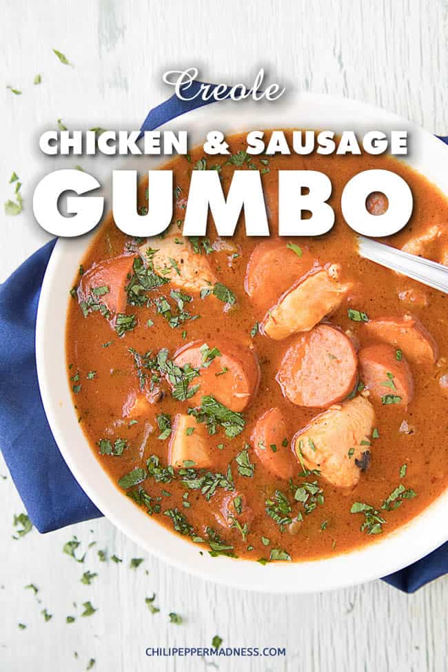 The ultimate Creole chicken and sausage gumbo recipe made with a rich and creamy dark roux, bell peppers and other vegetables, seared chicken, smoked andouille, tomato, and plenty of Creole seasoning. When you're done with a bowl, you'll beg for more. | ChiliPepperMadness.com #Cajun #Creole #Gumbo #CreoleCuisine #CreoleCooking #CajunCuisine #CajunFood #OnePot #Dinner
