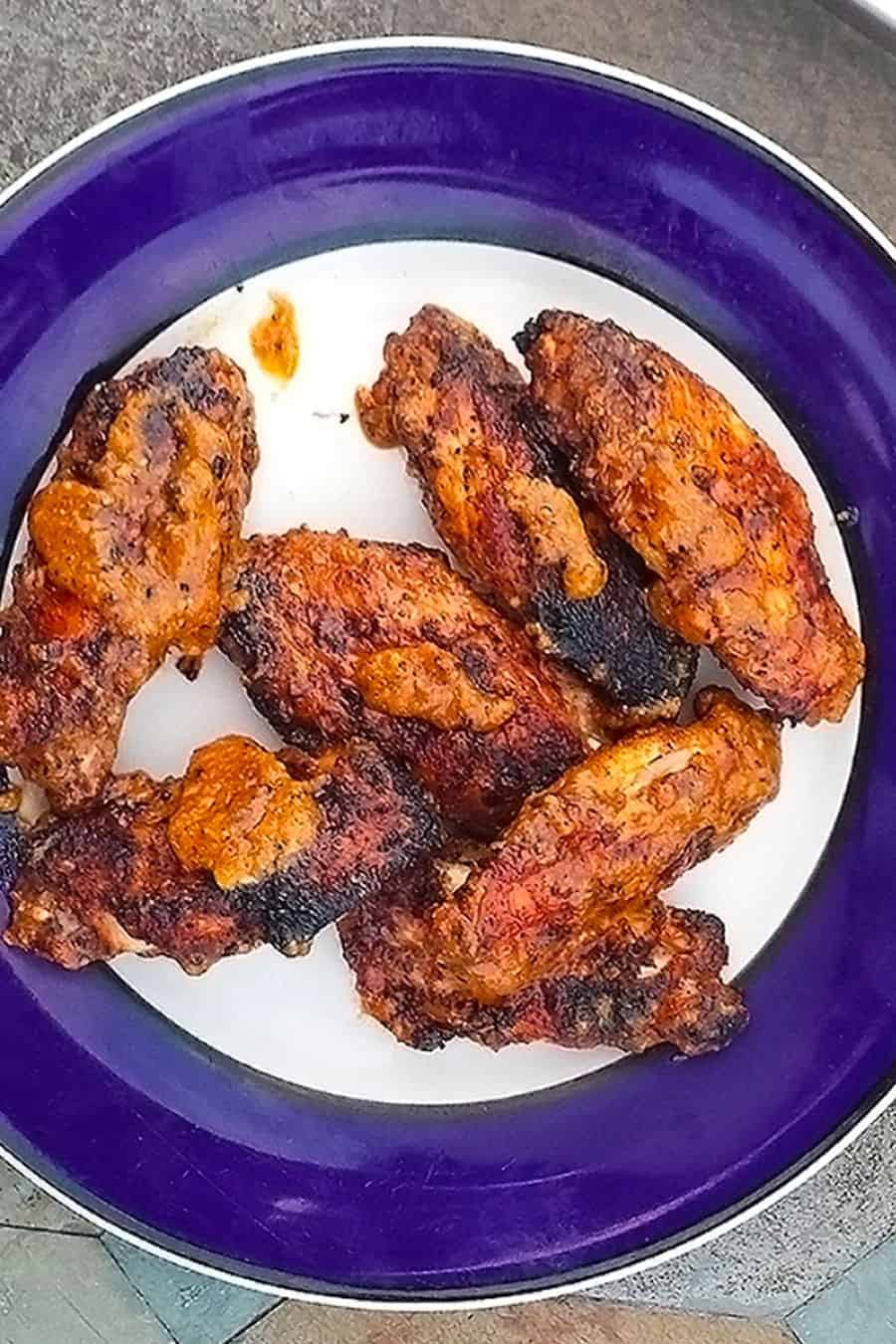 Spicy Grilled Chicken Wings served on a plate 