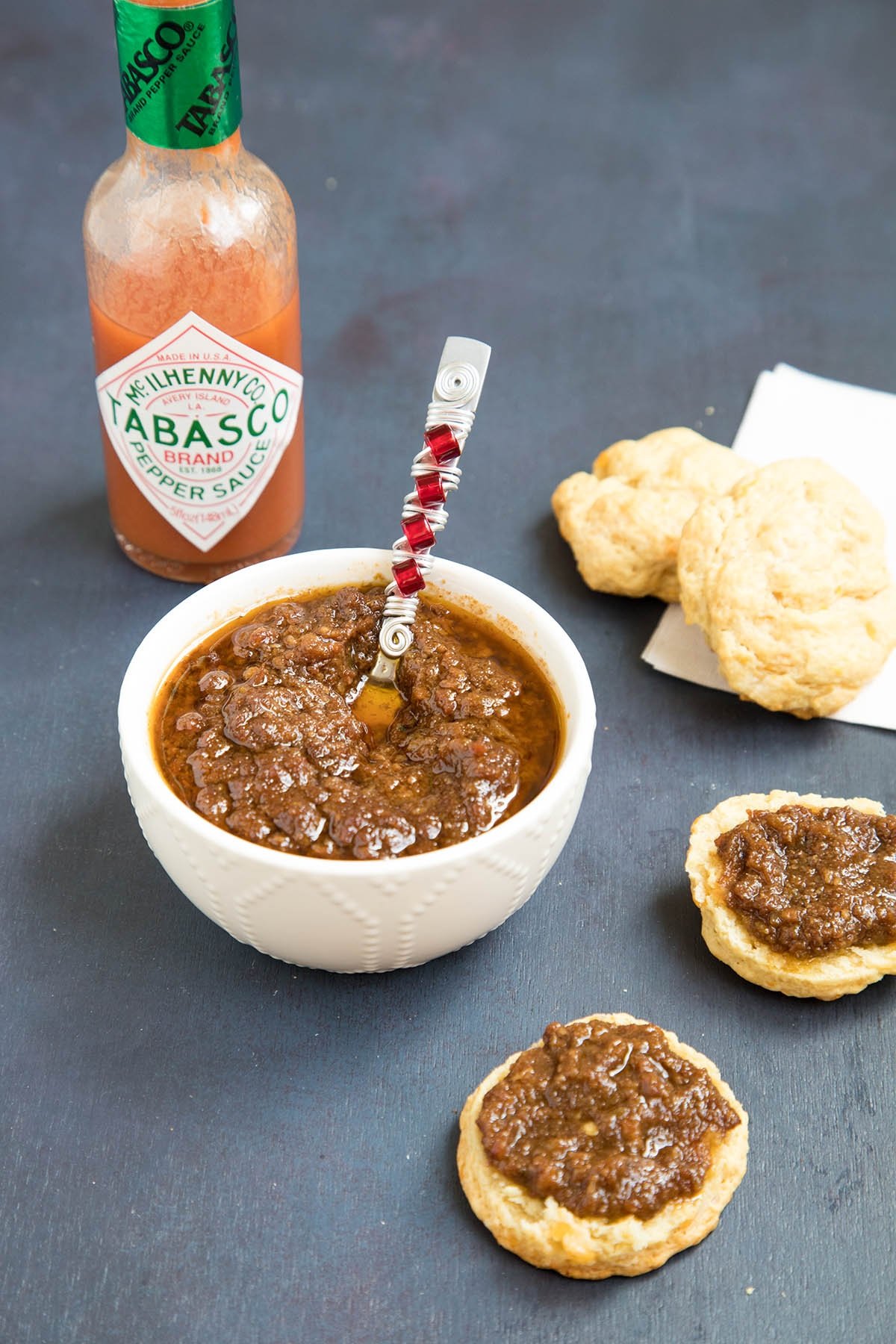 Bacon Onion Jam served in a bowl and on crackers.