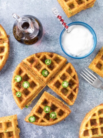 Serrano-Cheddar Waffles served to the table