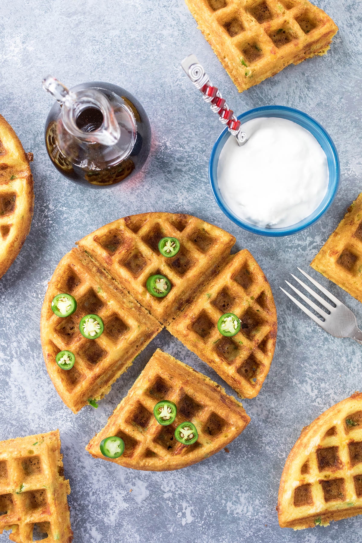 Serrano-Cheddar Waffles served to the table