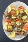 Easy BBQ Skewer Party with skewres served on a a plate.