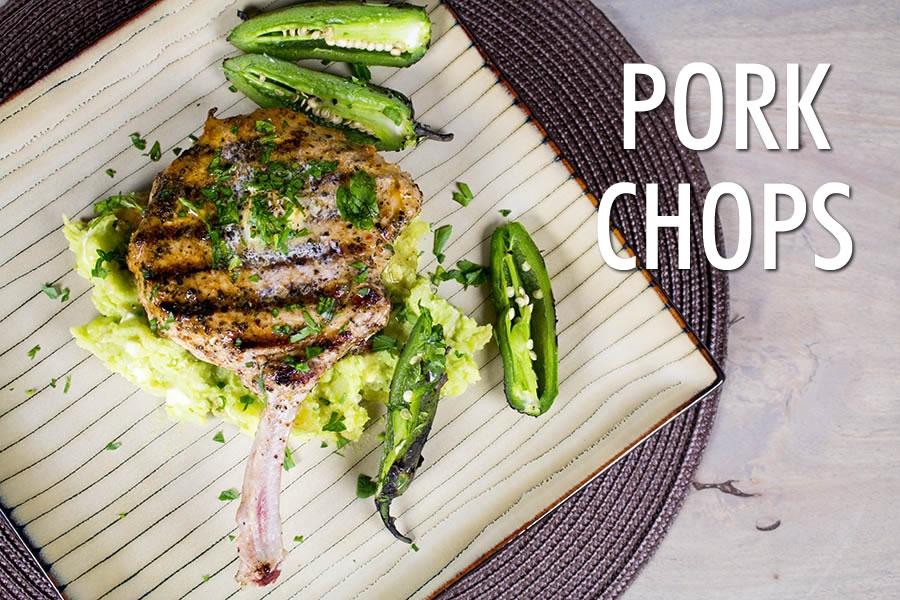 grilled pork chops over avocado-potato smash with roasted jalapeno peppers