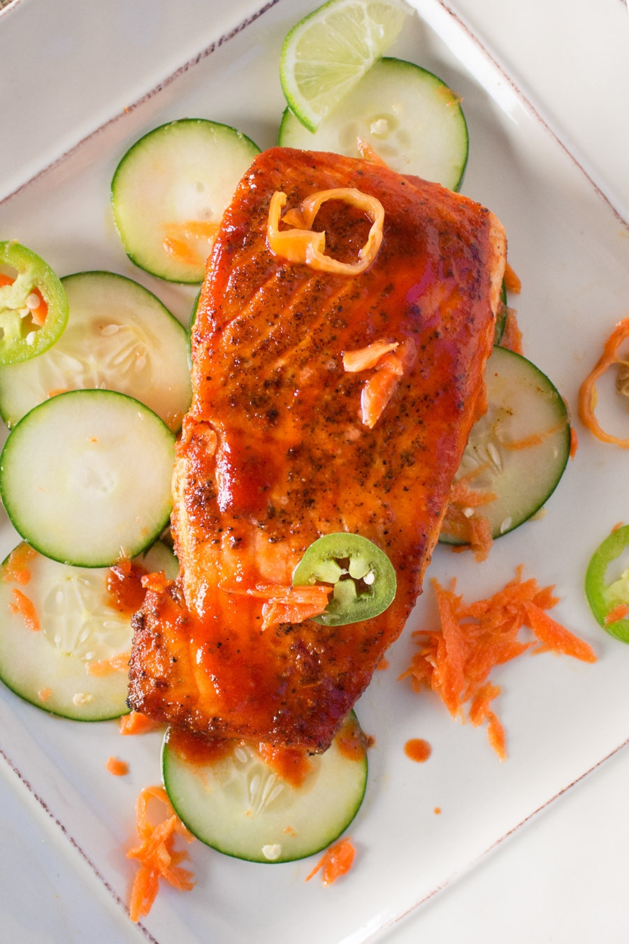 grilled salmon with honey-sriracha sauce and spicy cucumber salad