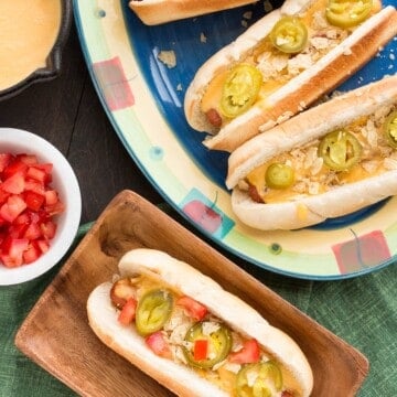 The Ultimate Nacho Cheese Dog served with sides.