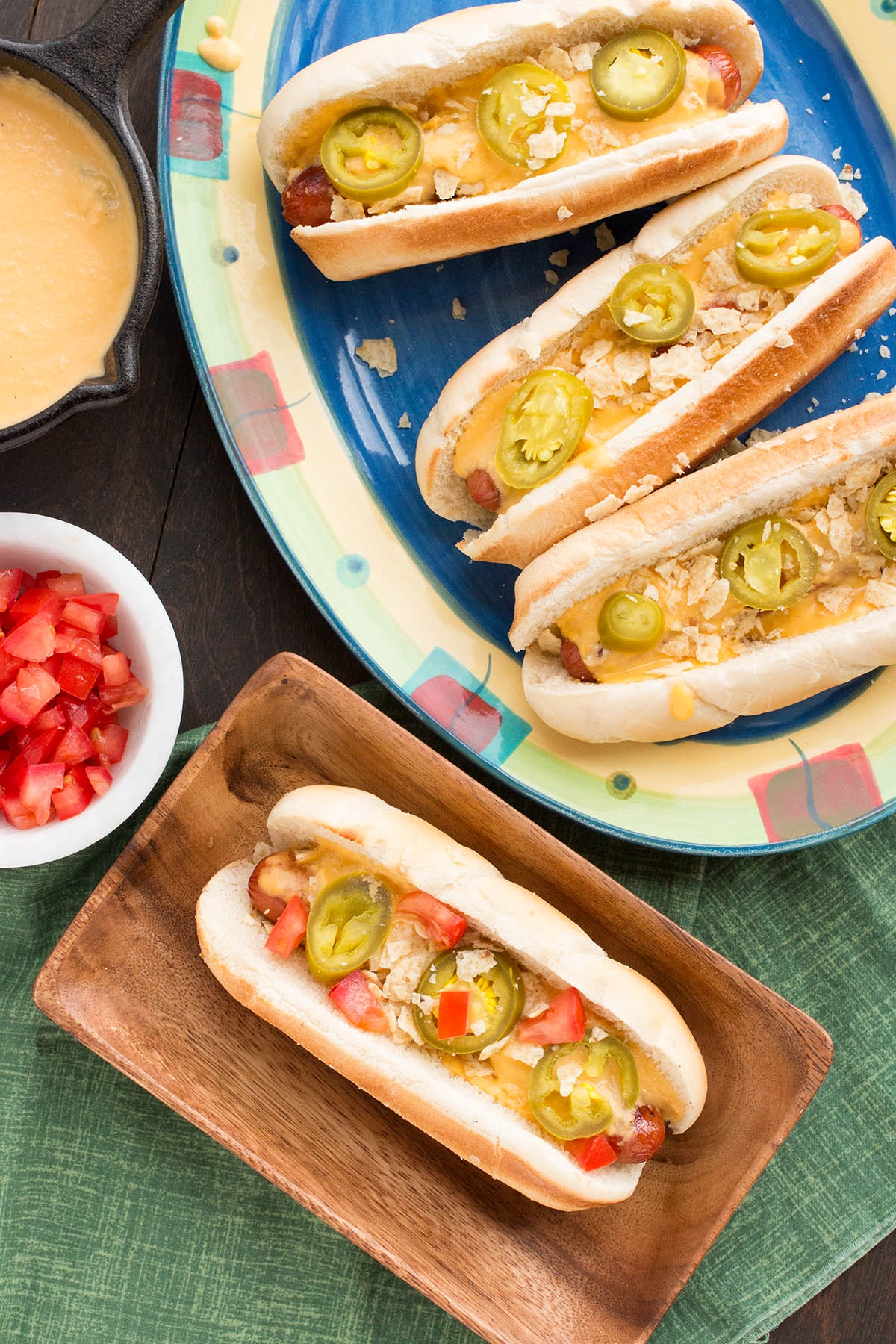 The Ultimate Nacho Cheese Dog served with sides.