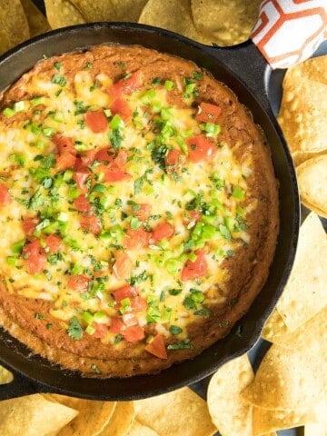 Easy Cheesy Chipotle Bean Dip served with chips.