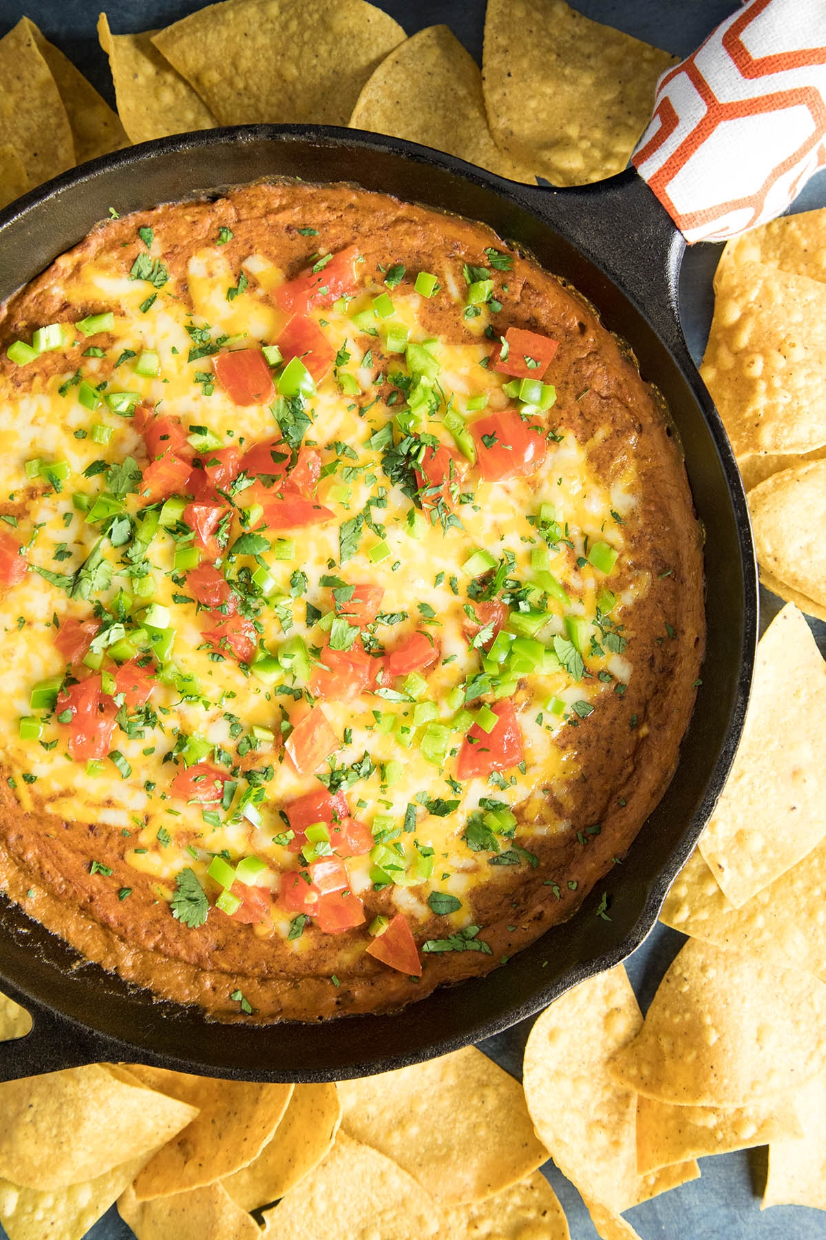 Easy Cheesy Chipotle Bean Dip served with chips.