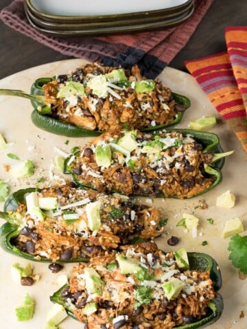 Serving the most delicious Chicken and Black Bean Stuffed Poblano Peppers ever