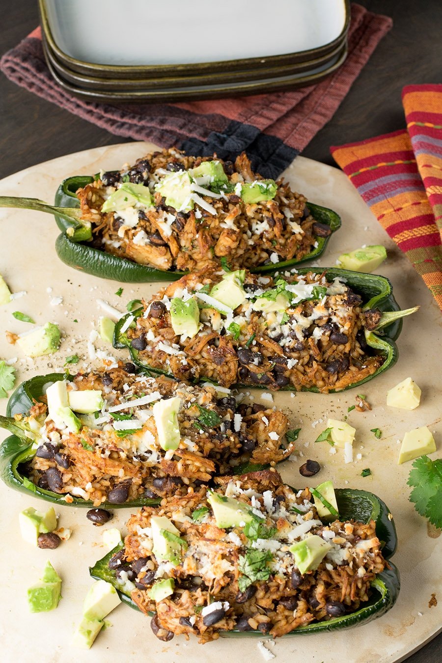 Serving the most delicious Chicken and Black Bean Stuffed Poblano Peppers ever