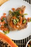 Baked Bone-In Pork Chops with Papaya Salsa served.