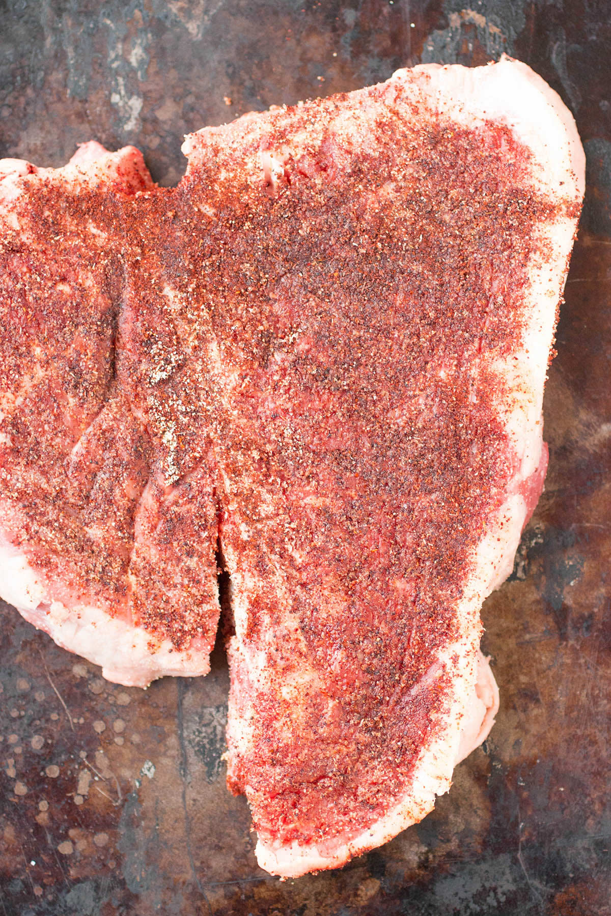 Seasoning the Ancho Crusted Porterhouse Steak