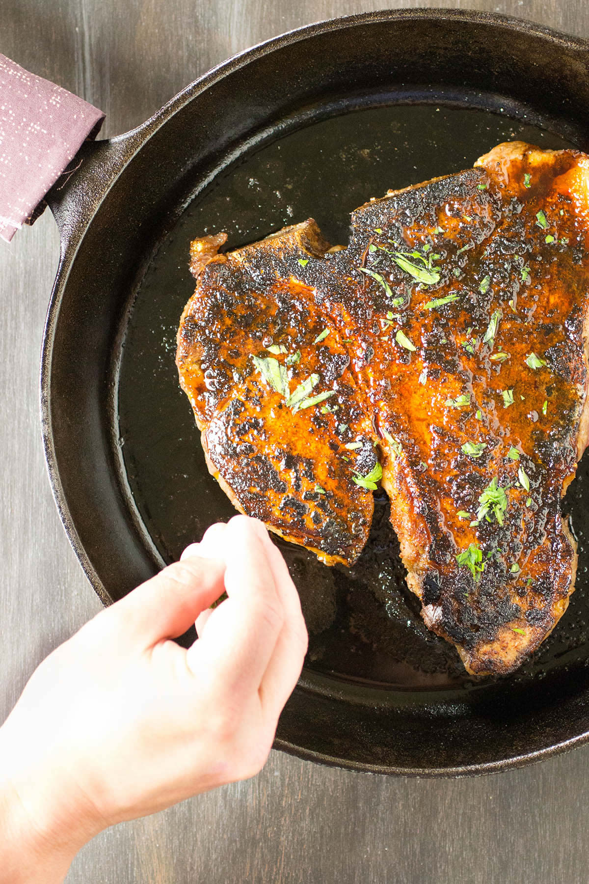 Tossing a few fresh herbs on top of the Ancho Crusted Porterhouse Steak