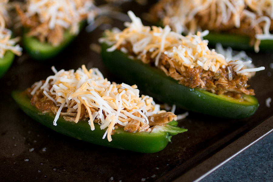 Top your jalapeno poppers with cheese.