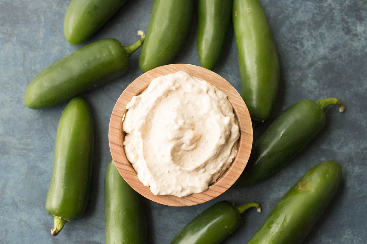 Jalapeno Poppers around a small bowl of the gorgeous beer dip