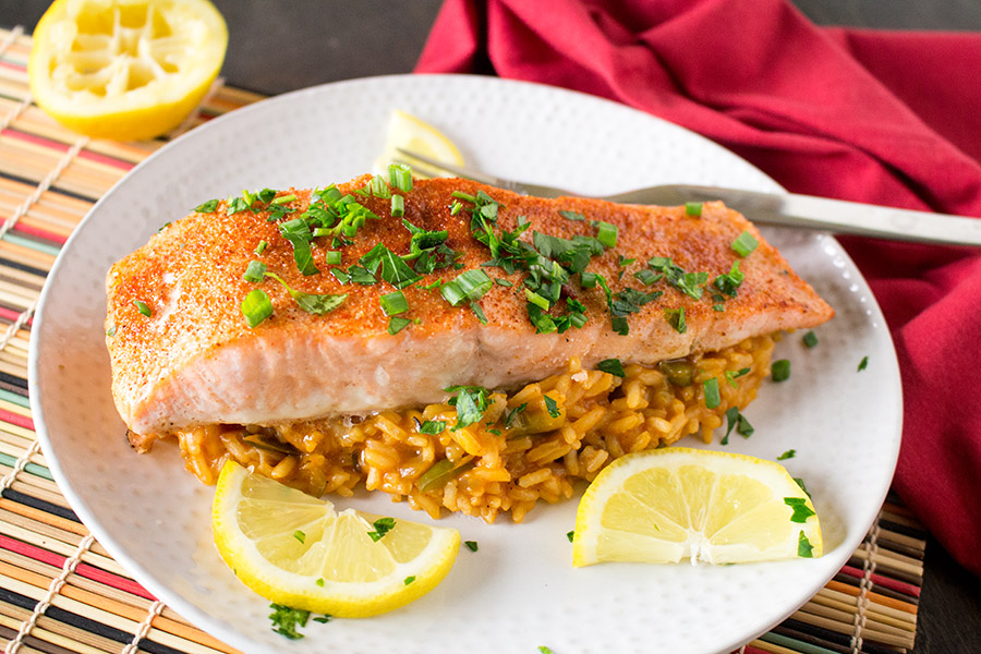 Cajun Baked Salmon with Cajun Rice served on a white plate