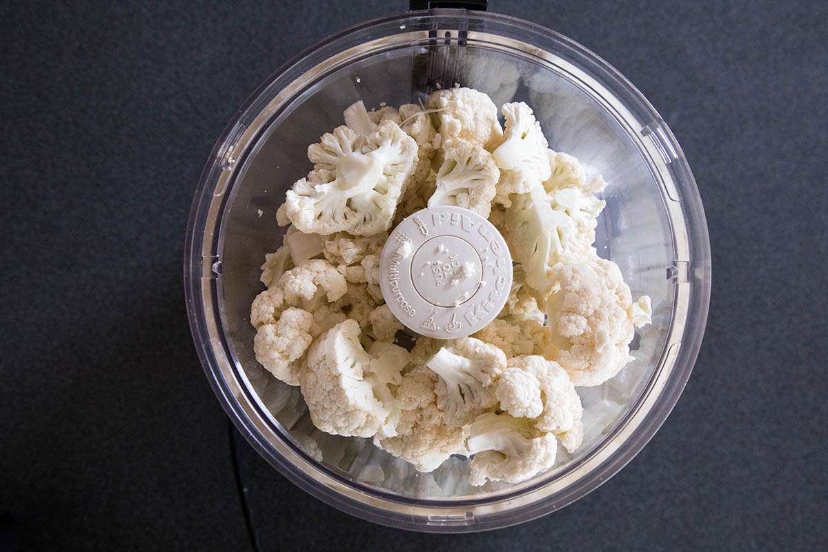 Adding the Cauliflower to a Food Processor.