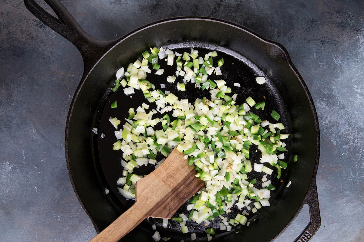 Cooking down the Cajun Holy Trinity with Jalapeno Peppers.