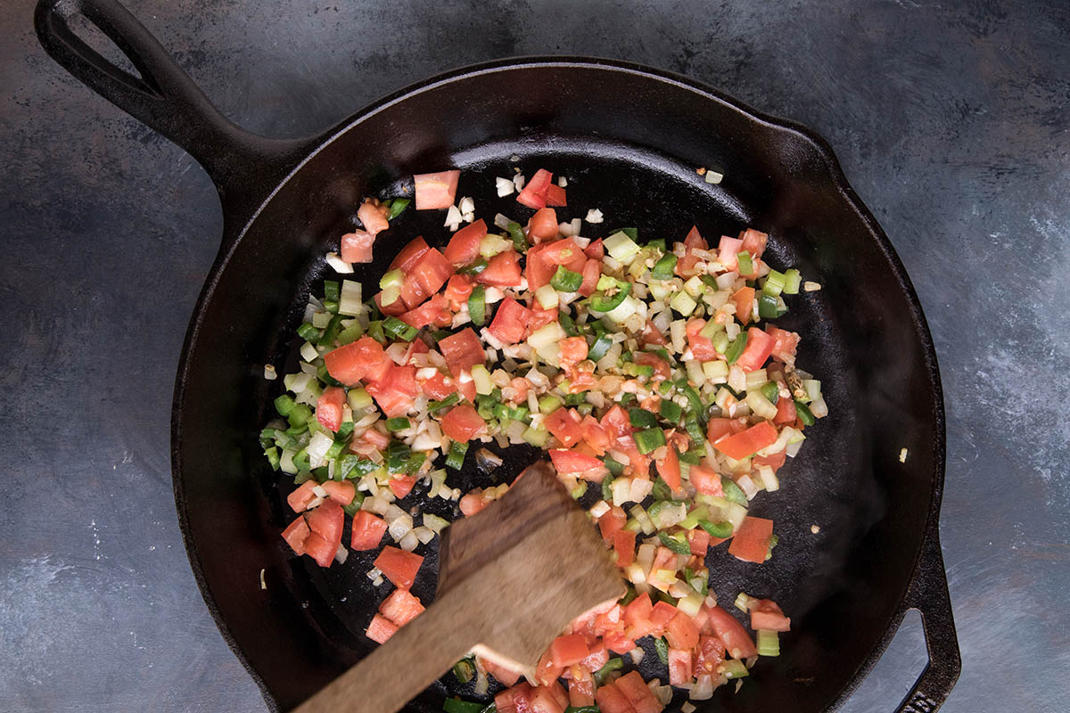 Adding the Garlic and Tomatoes.