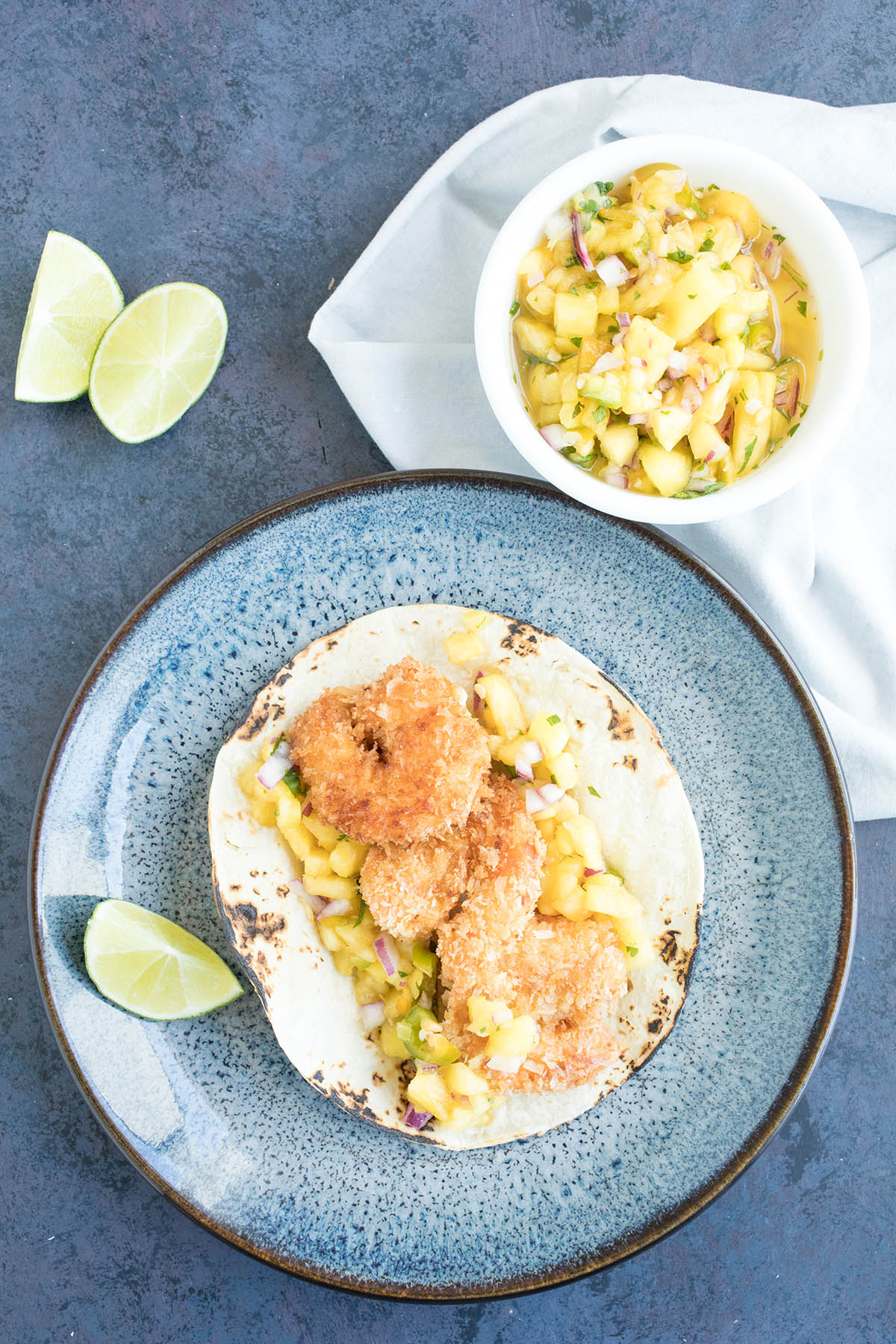 Caribbean Coconut Shrimp Tacos with Pineapple-Mango Salsa served.