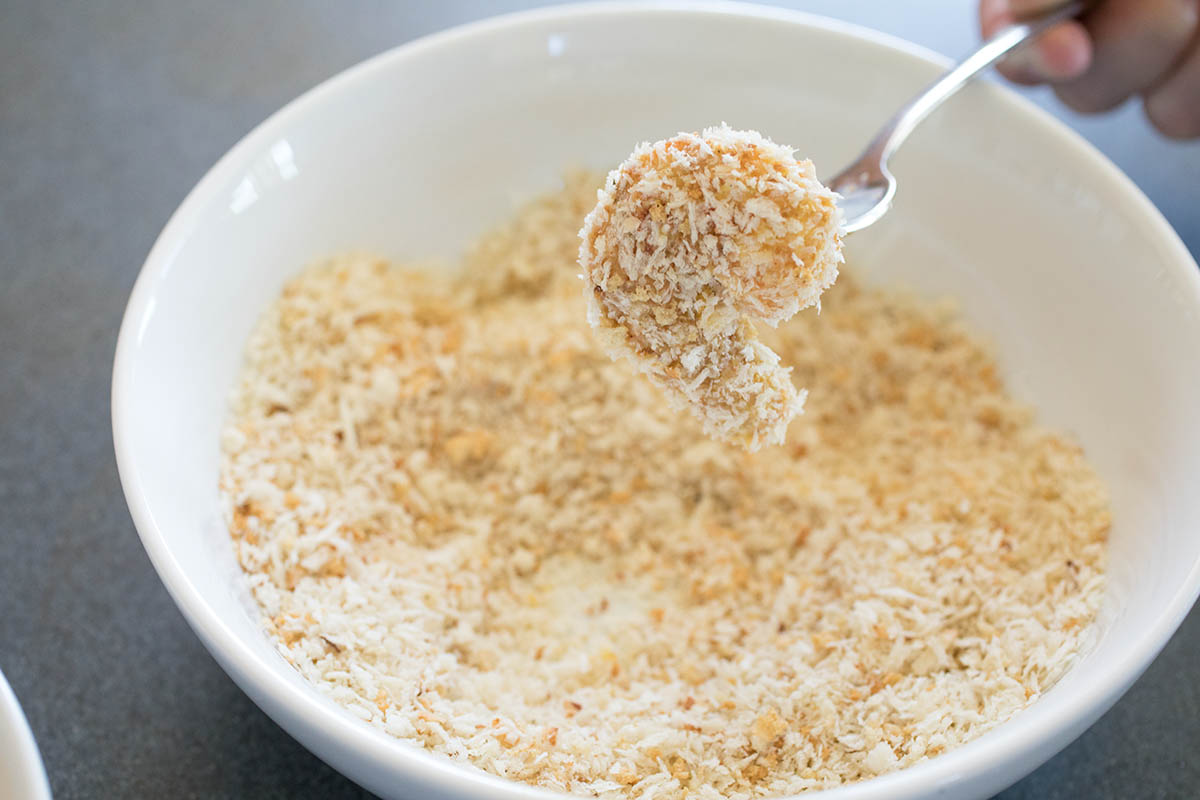 Coating the shrimp in panko.