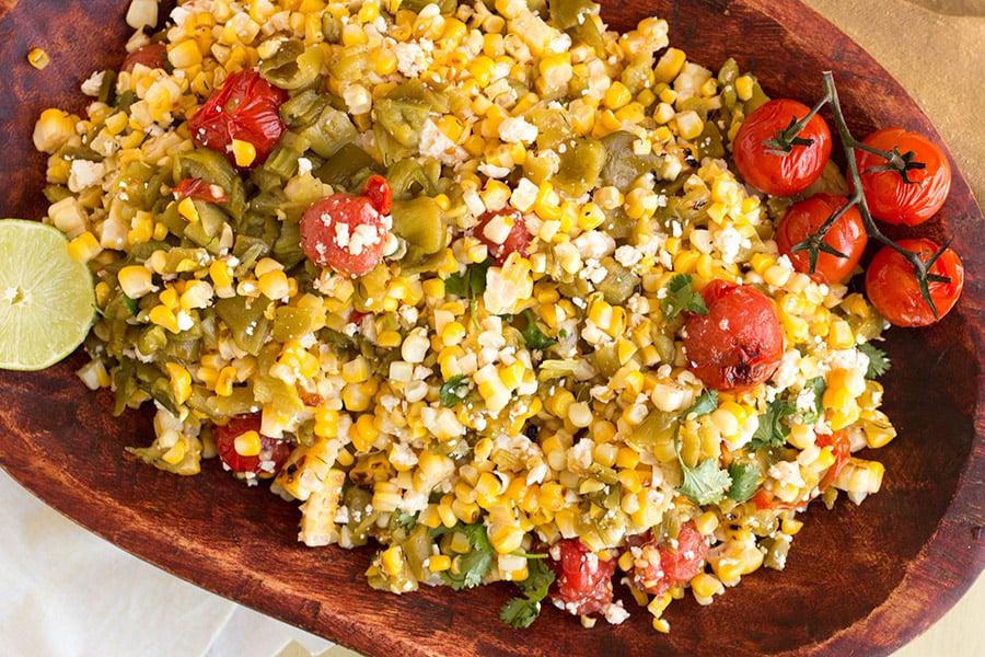 Charred Corn Salad with Hatch Green Chiles ready and served in a wooden bowl