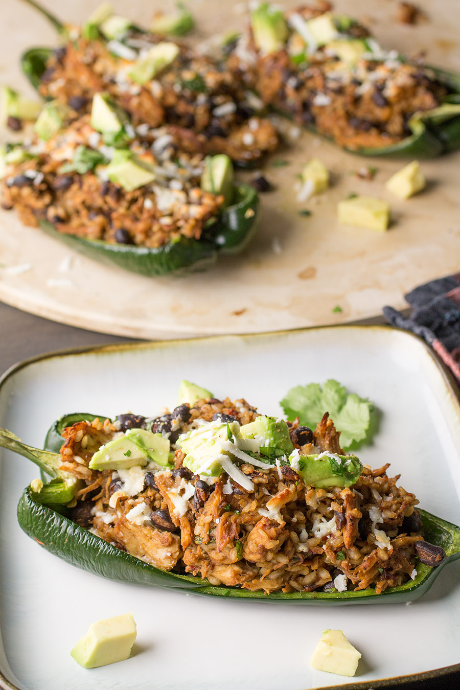 One of the Chicken and Black Bean Stuffed Poblano Peppers on the plate