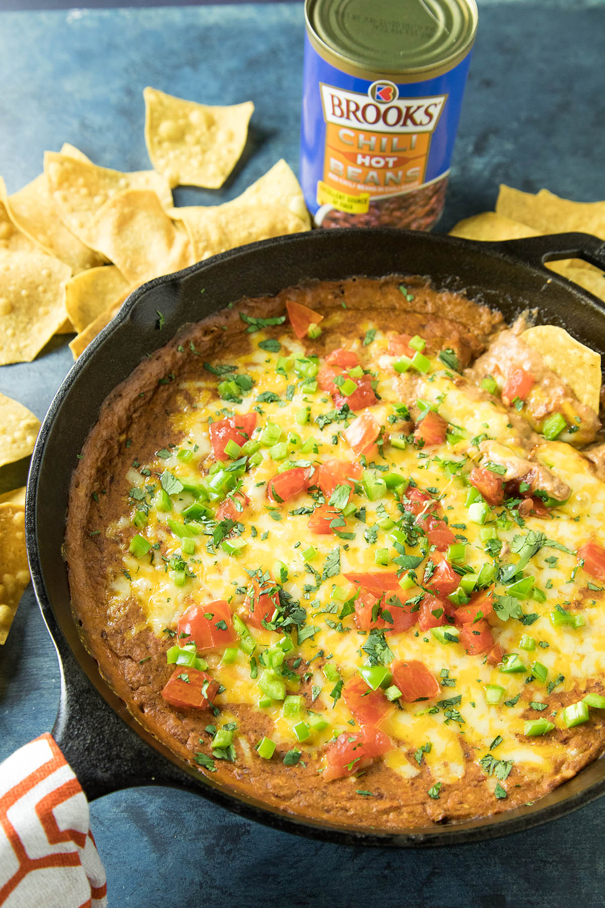 Easy Cheesy Chipotle Bean Dip - This easy-to-make bean dip delivers HUGE flavor with Brooks Chili Beans, tangy chipotle sauce, and plenty of cheese. A must-have party appetizer dip. Get the recipe.