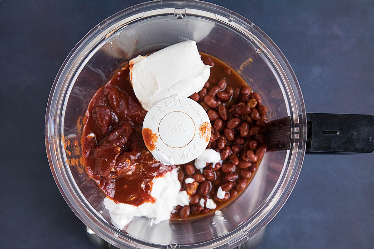 Easy Cheesy Chipotle Bean Dip ingredients in a blender.