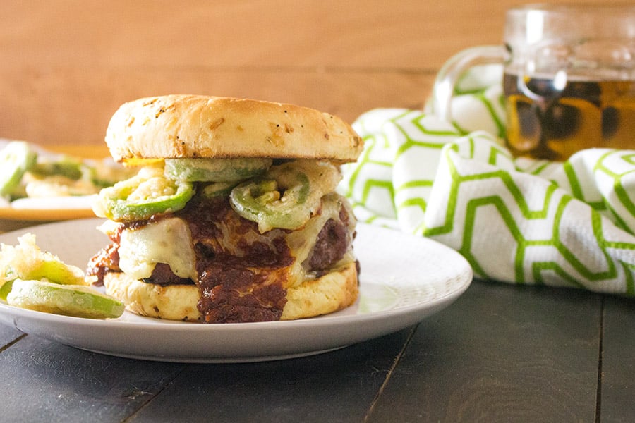 Juicy Grilled Burgers with BBQ Sauce served on a white plate