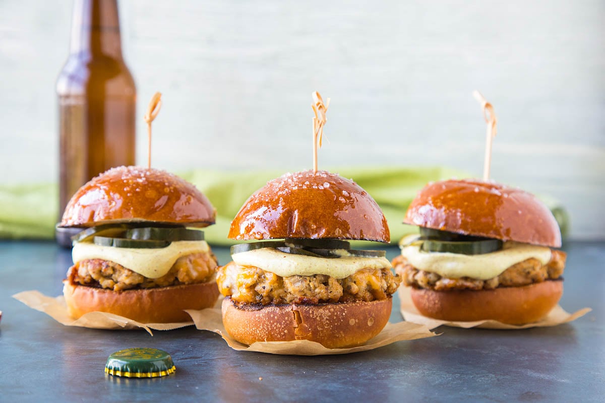 Three Ground Pork Sliders with Mustard Cream and Quick Pickled Cucumbers