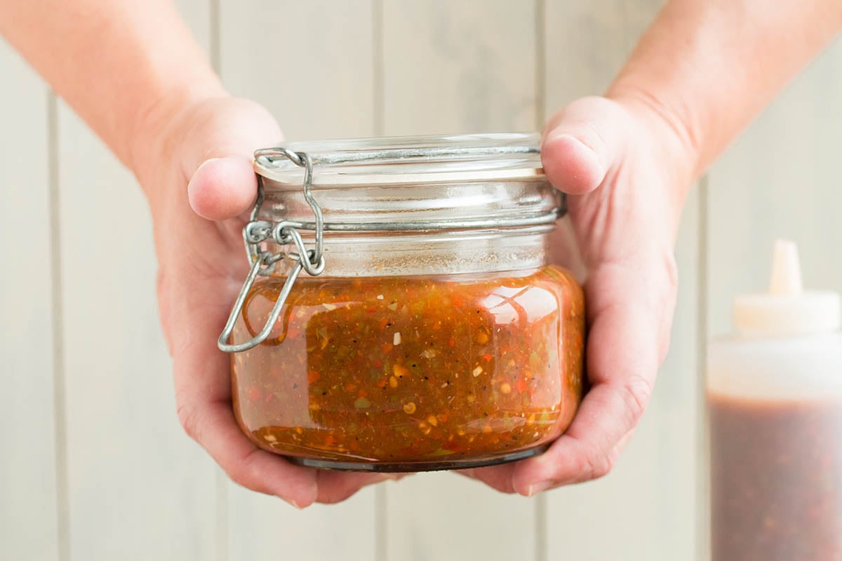 A jar full of the delicious Homemade Picante Sauce.