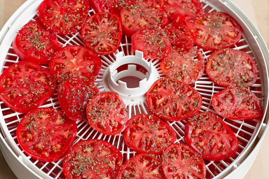 Sun drying tomatoes with a dehydrator.