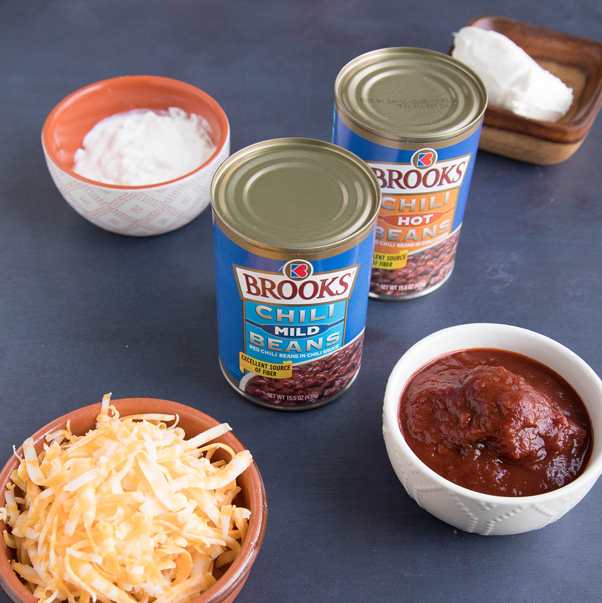 Brooks Chili Mild Beans with other ingredients on a table.