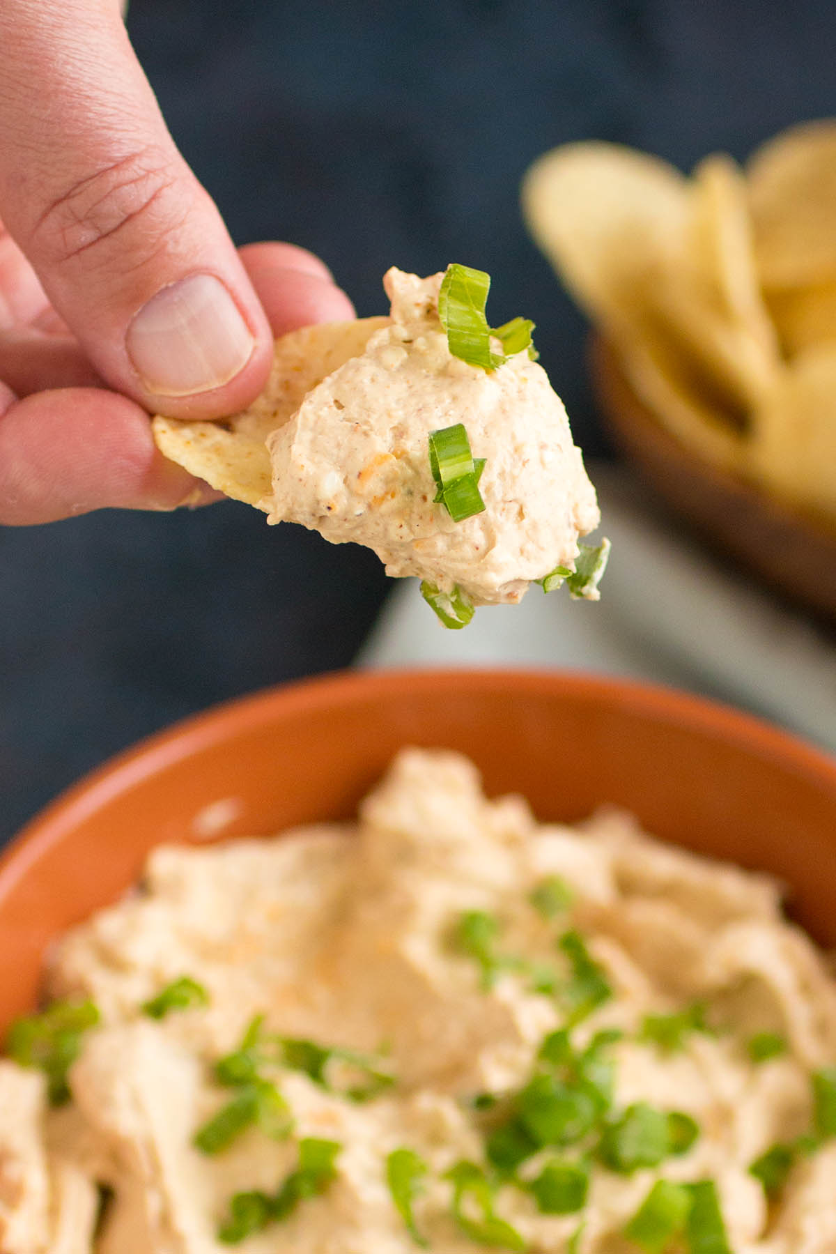 A chip full of the delicious spicy beer dip.
