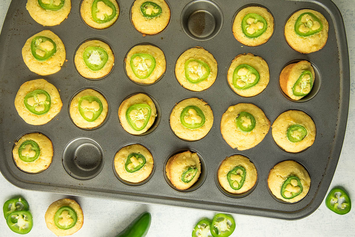 Cheesy Jalapeno Popper Cornbread Muffins in a baking tray.