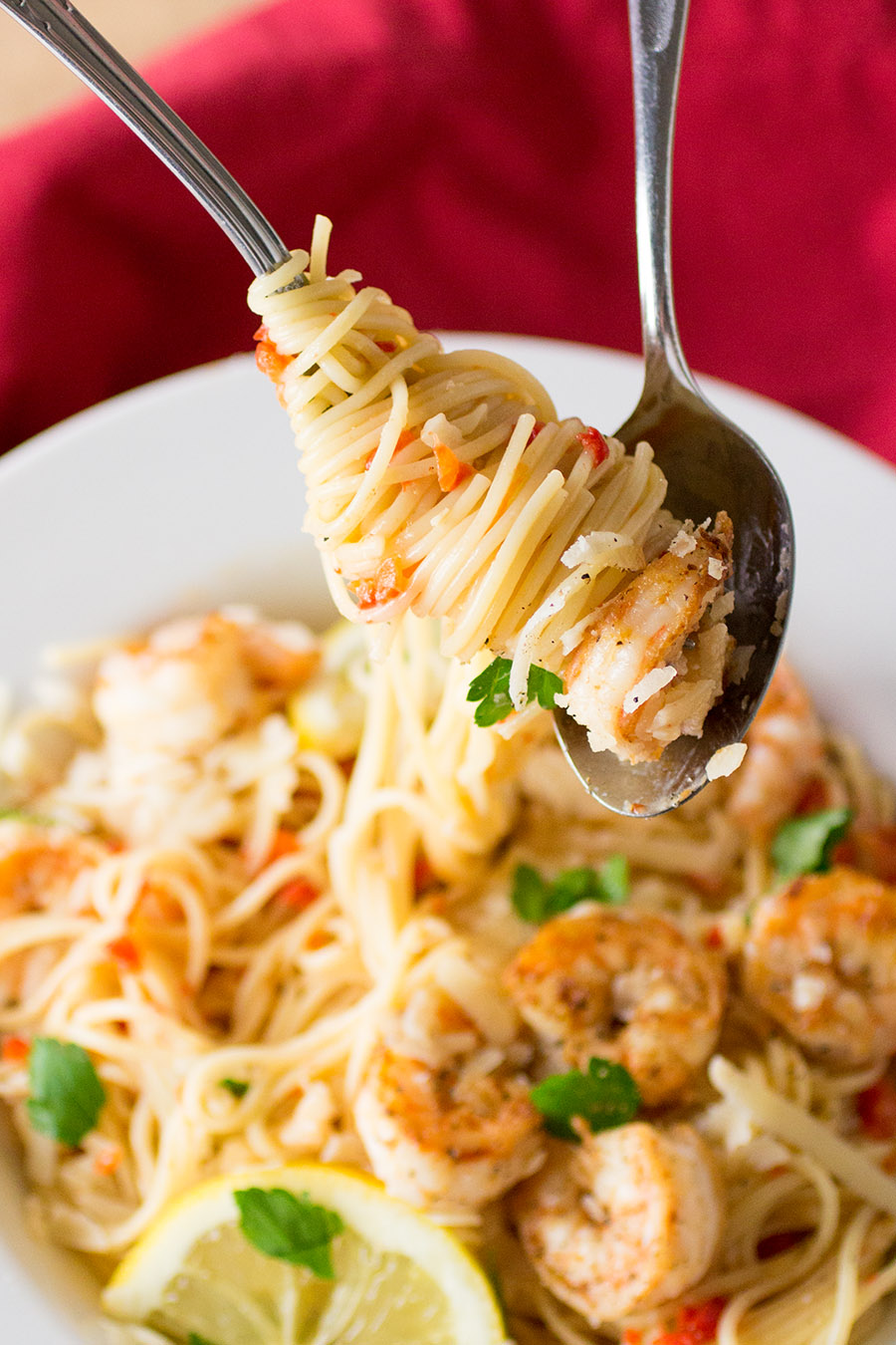 A forkful of the delicious Shrimp Pasta with Creamy Roasted Red Pepper Sauce