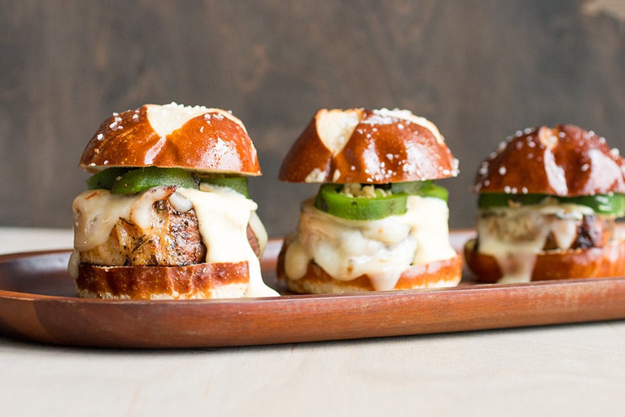 Three Pork Sliders with Creamy Honey Mustard served on a board