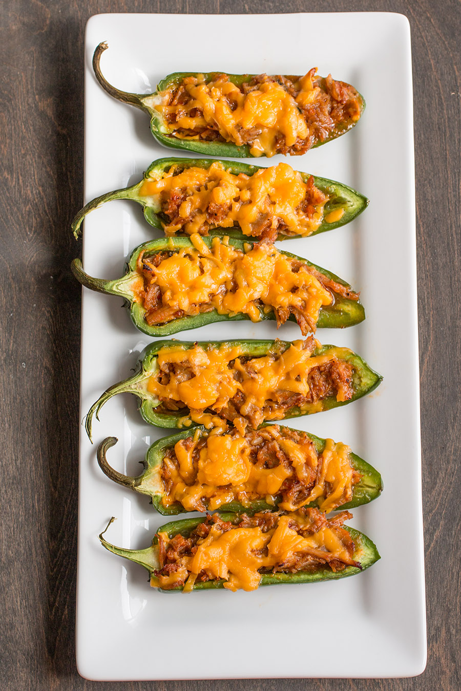 Pulled Pork-Sriracha Jalapeno Poppers serve don a big white tray