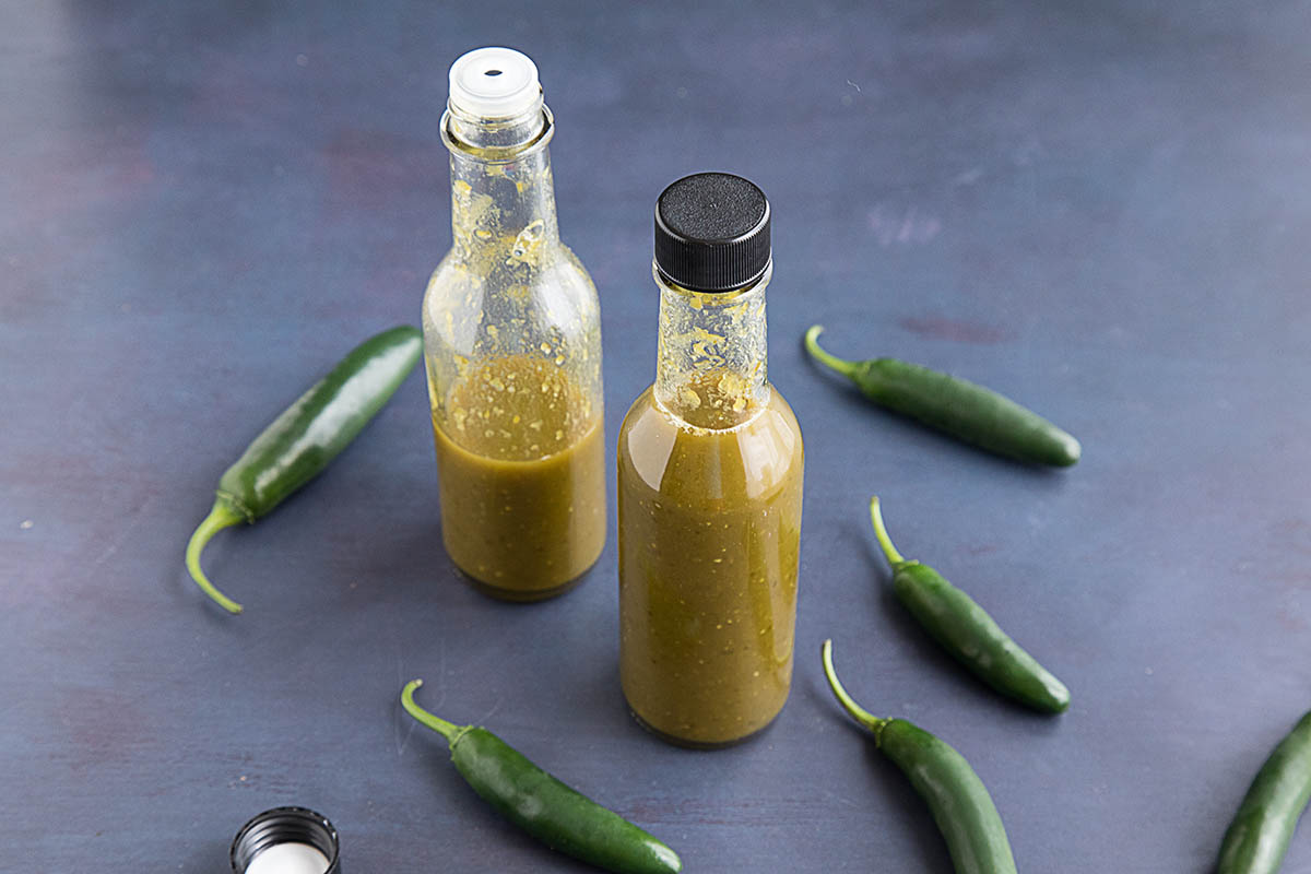 Spicy Serrano Hot Sauce served in two bottles