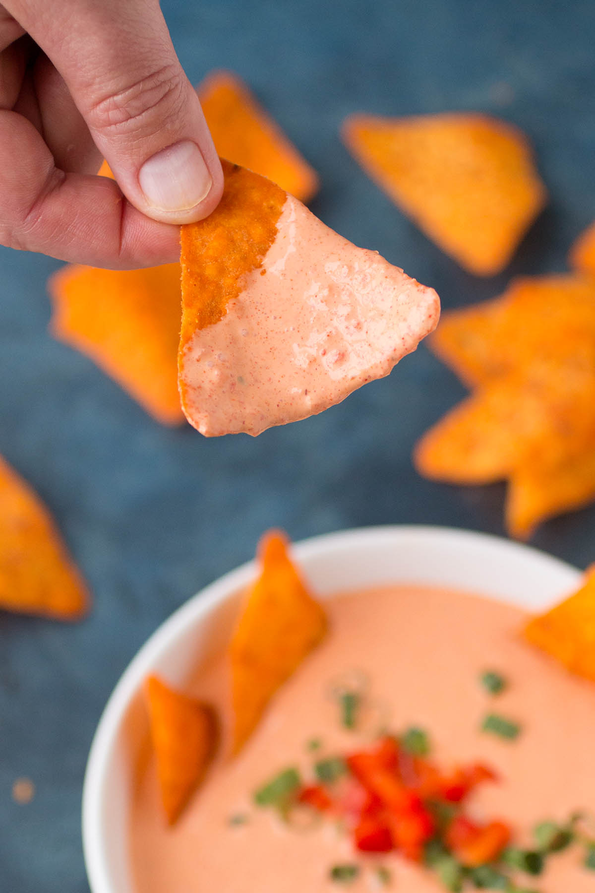 A chip dipped into the Spicy Cajun Dip.