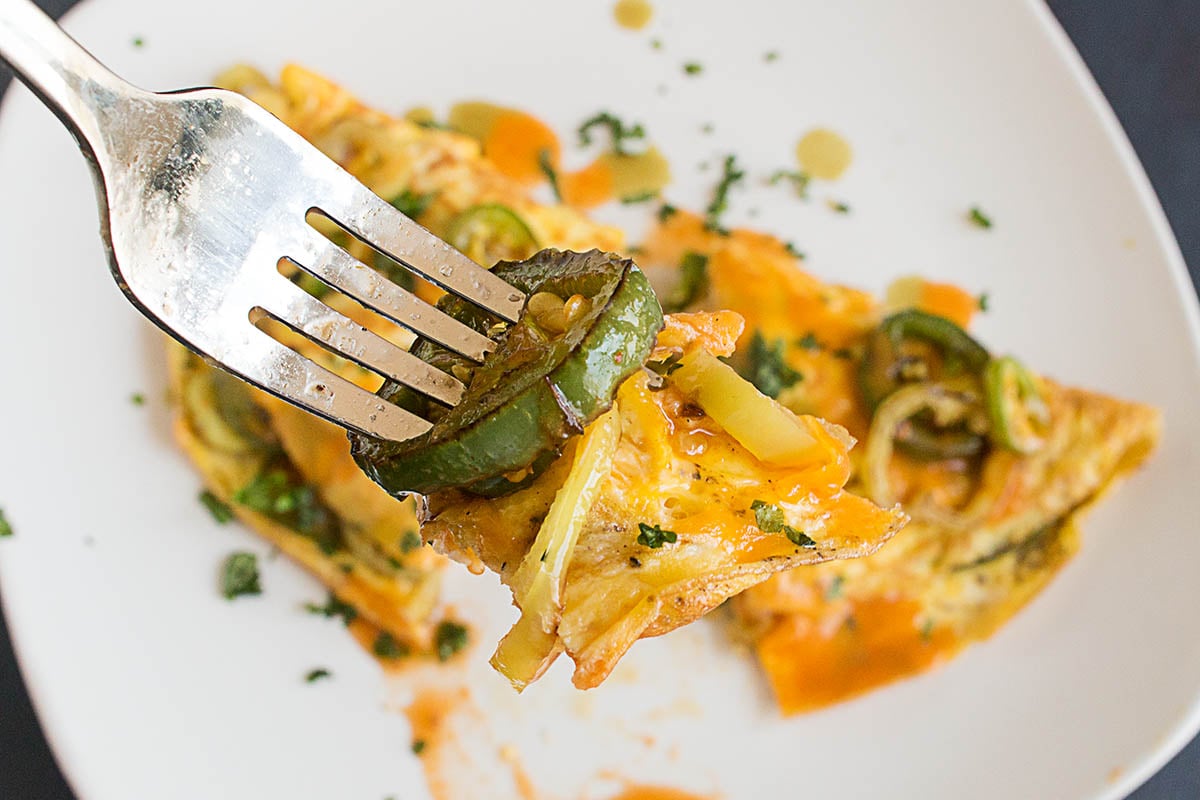 A forkful of the delicious Spicy Pepper Lovers Omelet