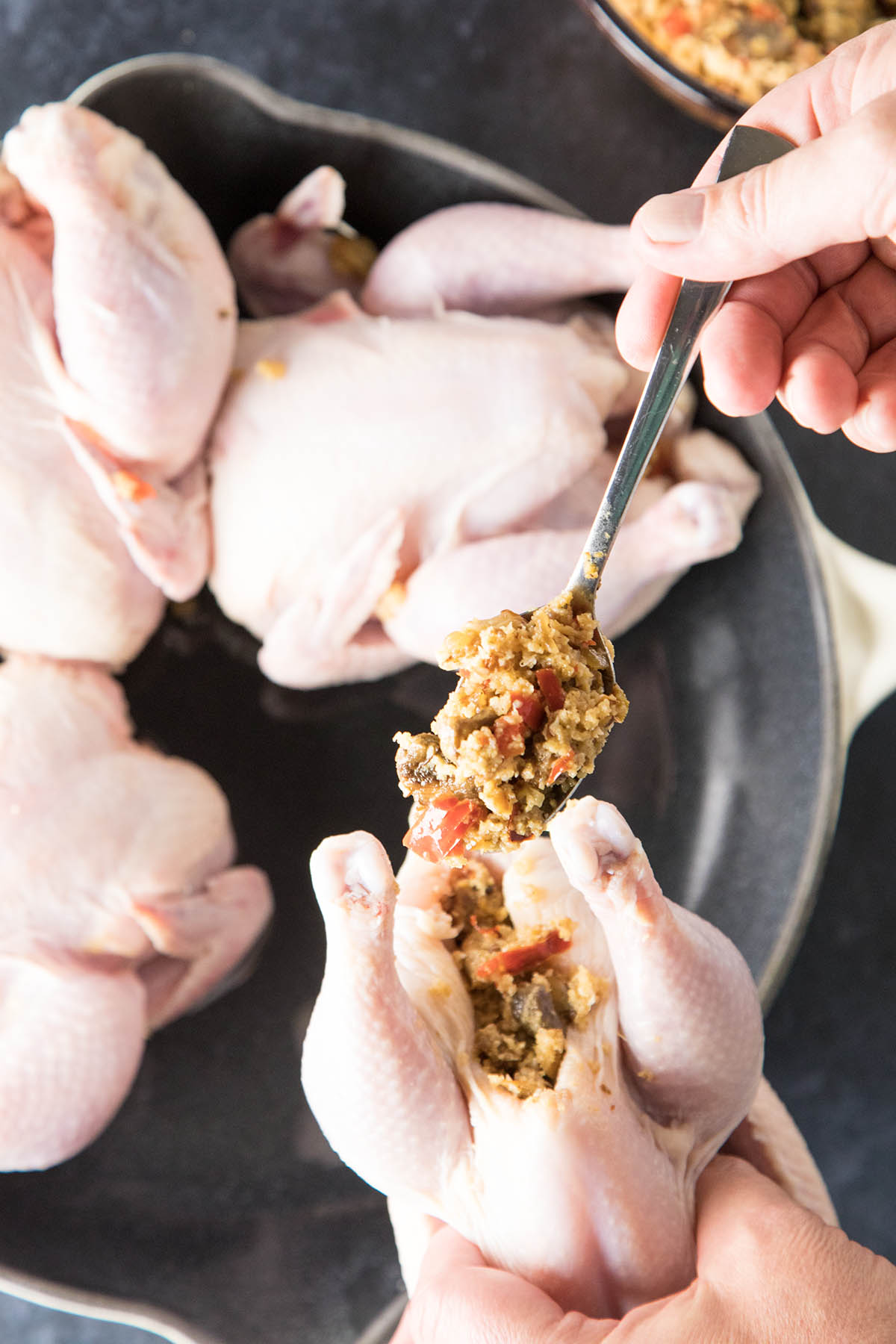 Stuffing the Hens for Honey-Soy Glazed Cornish Hens with Sausage-Panko Stuffing - Recipe